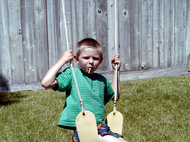 Devin on a swing